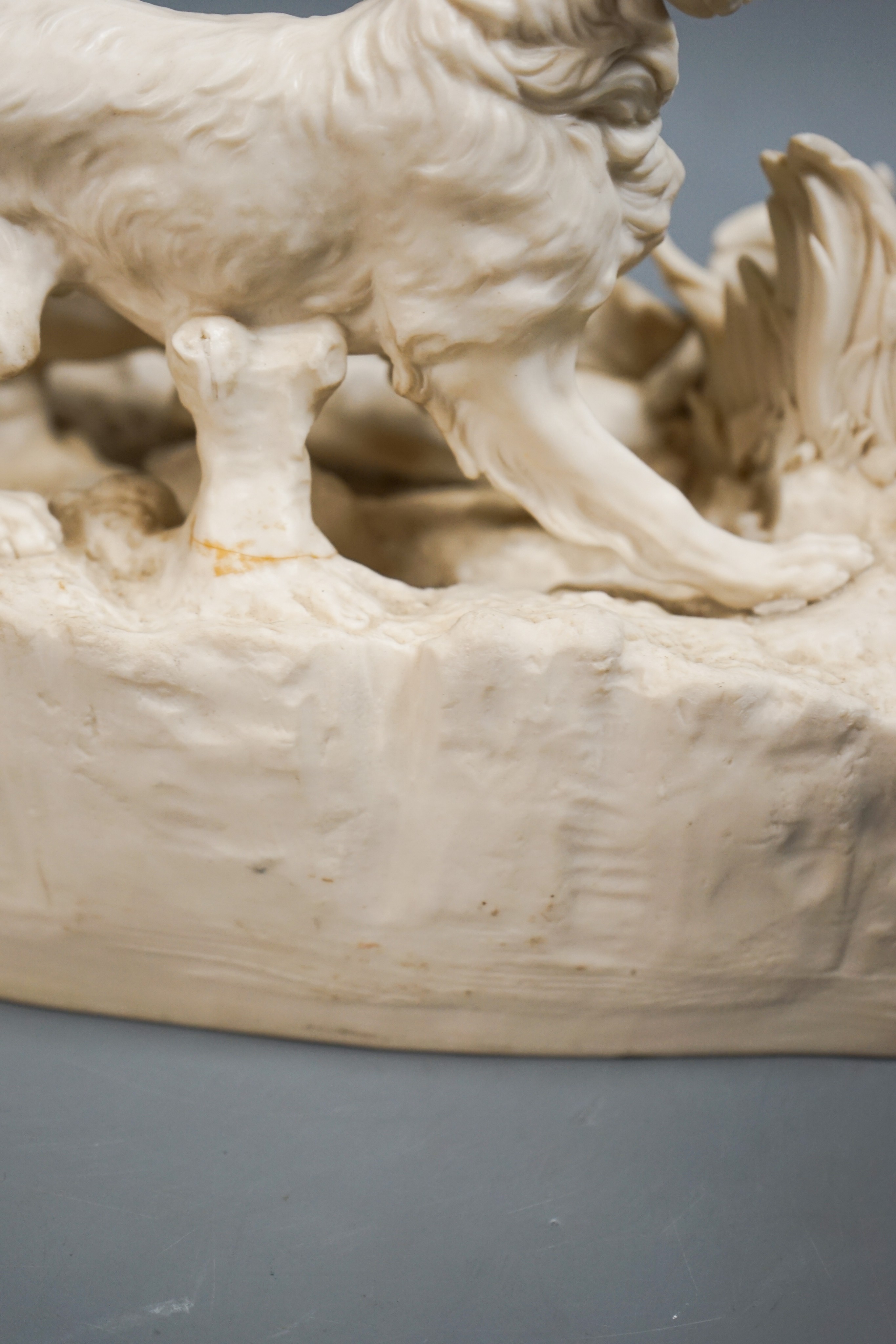 A Victorian parian group of two setters flushing a partridge, after Mene, 32cm (a.f.)